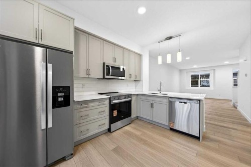 90 Heirloom Passage Se, Calgary, AB - Indoor Photo Showing Kitchen With Upgraded Kitchen