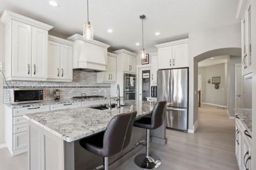 138 Reunion Landing, Airdrie, AB - Indoor Photo Showing Kitchen With Stainless Steel Kitchen With Upgraded Kitchen