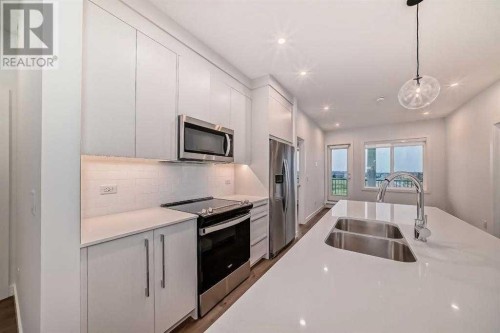 2409-395 Skyview Parkway Ne, Calgary, AB - Indoor Photo Showing Kitchen With Stainless Steel Kitchen With Double Sink With Upgraded Kitchen
