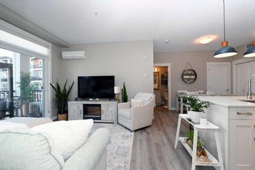 210-20 Walgrove Walk Se, Calgary, AB - Indoor Photo Showing Living Room