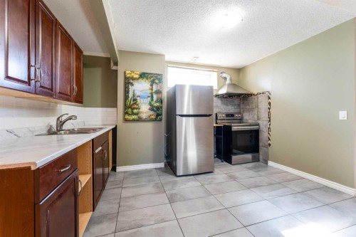 343 Millview Bay Sw, Calgary, AB - Indoor Photo Showing Kitchen With Double Sink
