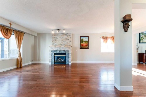 343 Millview Bay Sw, Calgary, AB - Indoor Photo Showing Living Room With Fireplace