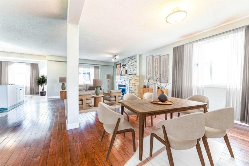 343 Millview Bay Sw, Calgary, AB - Indoor Photo Showing Dining Room With Fireplace