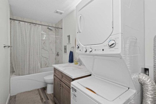 128 Bernard Close Nw, Calgary, AB - Indoor Photo Showing Laundry Room