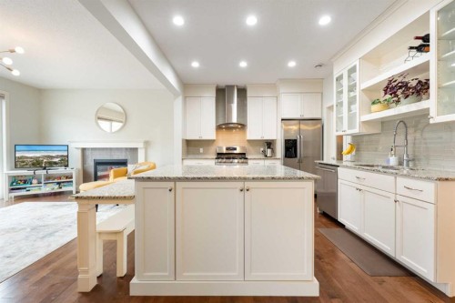 150 Auburn Springs Boulevard Se, Calgary, AB - Indoor Photo Showing Kitchen With Fireplace