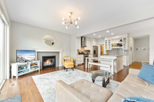 150 Auburn Springs Boulevard Se, Calgary, AB - Indoor Photo Showing Living Room With Fireplace