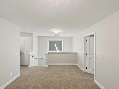 125 Edith Gate Nw, Calgary, AB - Indoor Photo Showing Other Room