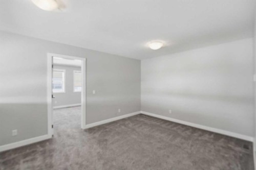 125 Edith Gate Nw, Calgary, AB - Indoor Photo Showing Other Room