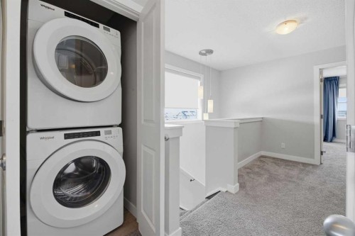 125 Edith Gate Nw, Calgary, AB - Indoor Photo Showing Laundry Room