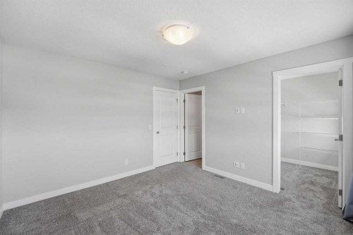 125 Edith Gate Nw, Calgary, AB - Indoor Photo Showing Other Room
