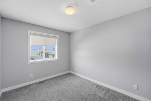 125 Edith Gate Nw, Calgary, AB - Indoor Photo Showing Other Room