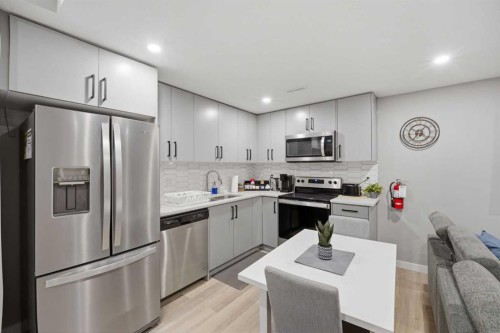 125 Edith Gate Nw, Calgary, AB - Indoor Photo Showing Kitchen With Stainless Steel Kitchen