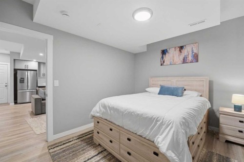 125 Edith Gate Nw, Calgary, AB - Indoor Photo Showing Bedroom