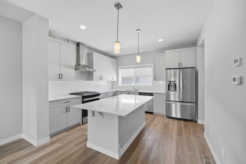 125 Edith Gate Nw, Calgary, AB - Indoor Photo Showing Kitchen With Stainless Steel Kitchen With Upgraded Kitchen