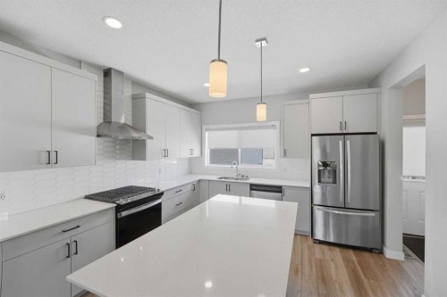 125 Edith Gate Nw, Calgary, AB - Indoor Photo Showing Kitchen With Stainless Steel Kitchen With Upgraded Kitchen