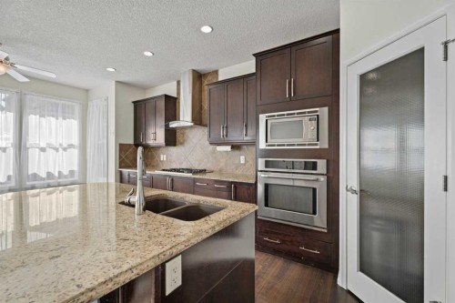 386 Mahogany Terrace Se, Calgary, AB - Indoor Photo Showing Kitchen With Stainless Steel Kitchen With Double Sink With Upgraded Kitchen