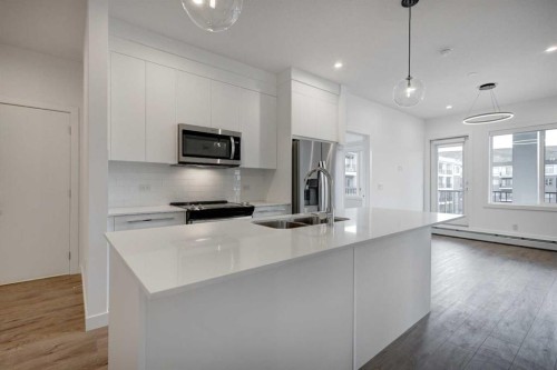 4304-111 Wolf Creek Drive Se, Calgary, AB - Indoor Photo Showing Kitchen With Double Sink With Upgraded Kitchen