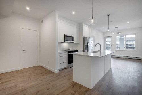 4304-111 Wolf Creek Drive Se, Calgary, AB - Indoor Photo Showing Kitchen With Upgraded Kitchen