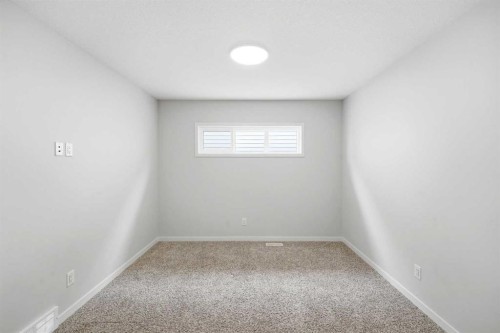 34 Aquila Way Nw, Calgary, AB - Indoor Photo Showing Other Room