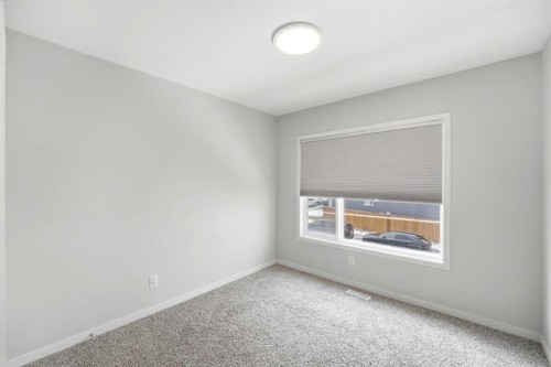 34 Aquila Way Nw, Calgary, AB - Indoor Photo Showing Other Room