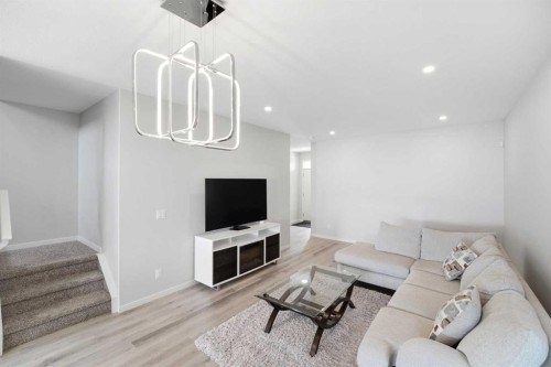34 Aquila Way Nw, Calgary, AB - Indoor Photo Showing Living Room