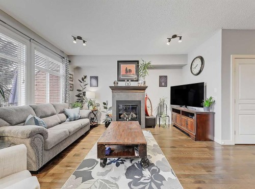 32-351 Monteith Drive Se, High River, AB - Indoor Photo Showing Living Room With Fireplace