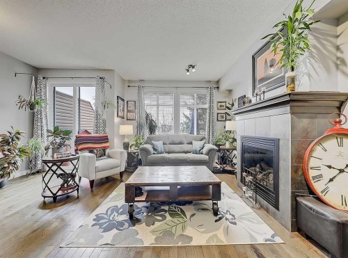 32-351 Monteith Drive Se, High River, AB - Indoor Photo Showing Living Room With Fireplace