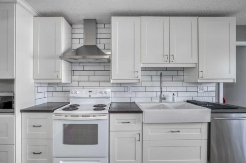 94 Glendale Way, Cochrane, AB - Indoor Photo Showing Kitchen With Double Sink