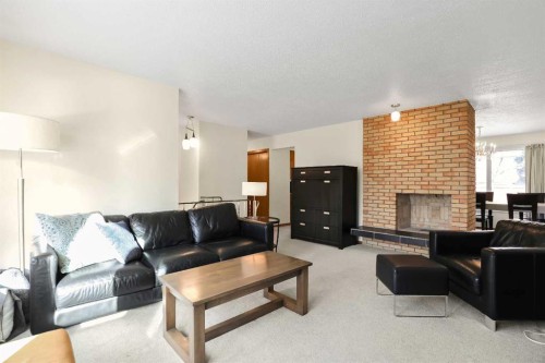 5711 Dalmead Crescent Nw, Calgary, AB - Indoor Photo Showing Living Room With Fireplace