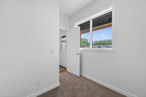 32 Red Embers Plaza Ne, Calgary, AB - Indoor Photo Showing Other Room