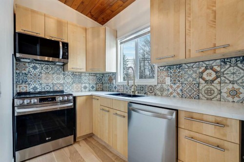 120 Oaktree Lane Sw, Calgary, AB - Indoor Photo Showing Kitchen With Double Sink