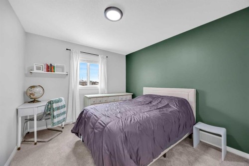 114 Morningside Circle Sw, Airdrie, AB - Indoor Photo Showing Bedroom