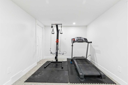 642 Schooner Cove Nw, Calgary, AB - Indoor Photo Showing Gym Room