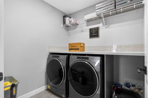 96 Emberside Glen, Cochrane, AB - Indoor Photo Showing Laundry Room