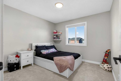 96 Emberside Glen, Cochrane, AB - Indoor Photo Showing Bedroom