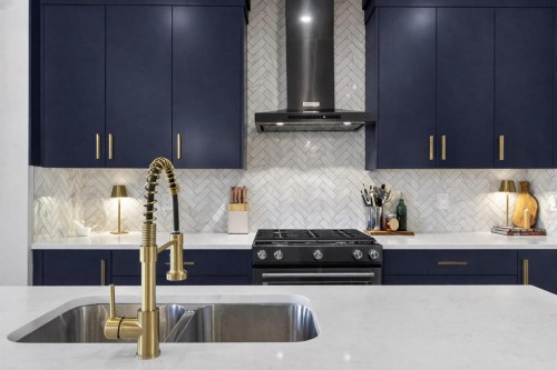 96 Emberside Glen, Cochrane, AB - Indoor Photo Showing Kitchen With Double Sink With Upgraded Kitchen