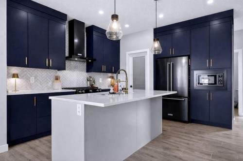 96 Emberside Glen, Cochrane, AB - Indoor Photo Showing Kitchen With Upgraded Kitchen