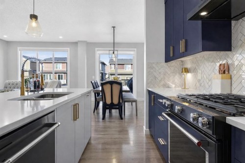 96 Emberside Glen, Cochrane, AB - Indoor Photo Showing Kitchen With Double Sink With Upgraded Kitchen