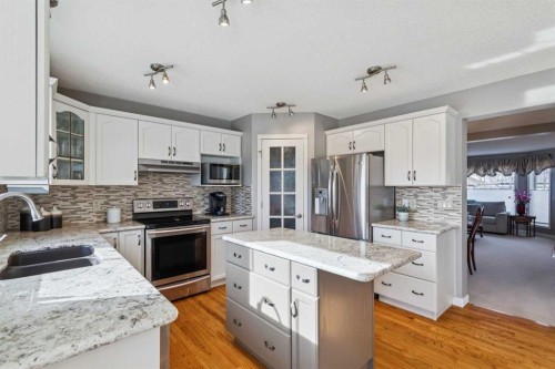 420 Rocky Ridge Bay Nw, Calgary, AB - Indoor Photo Showing Kitchen With Double Sink With Upgraded Kitchen