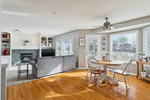 420 Rocky Ridge Bay Nw, Calgary, AB - Indoor Photo Showing Other Room With Fireplace