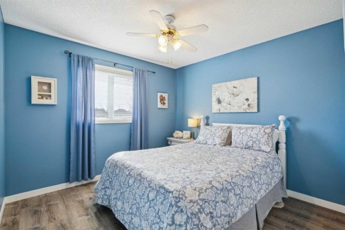 420 Rocky Ridge Bay Nw, Calgary, AB - Indoor Photo Showing Bedroom