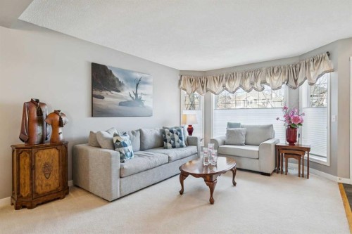 420 Rocky Ridge Bay Nw, Calgary, AB - Indoor Photo Showing Living Room