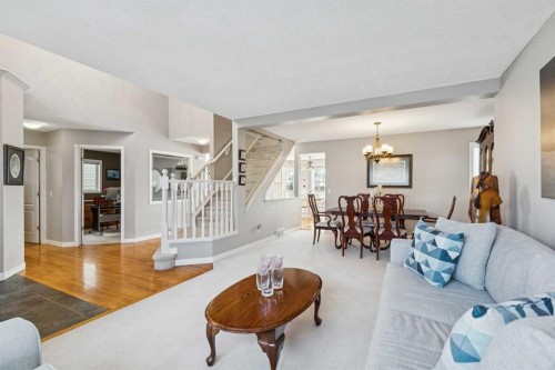 420 Rocky Ridge Bay Nw, Calgary, AB - Indoor Photo Showing Living Room