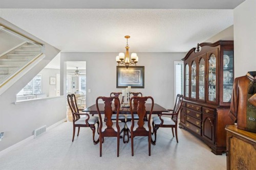 420 Rocky Ridge Bay Nw, Calgary, AB - Indoor Photo Showing Dining Room