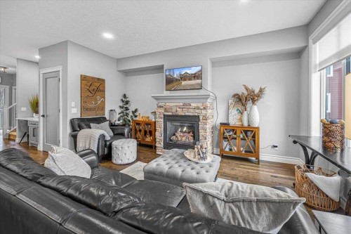 26-351 Monteith Drive Se, High River, AB - Indoor Photo Showing Living Room With Fireplace