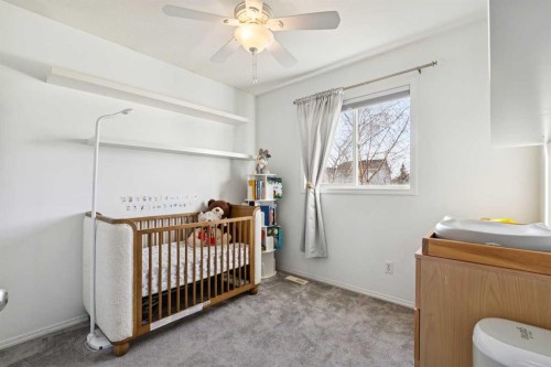 27 Everstone Way Sw, Calgary, AB - Indoor Photo Showing Bedroom