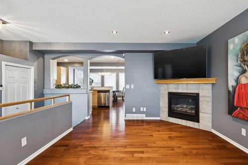 27 Everstone Way Sw, Calgary, AB - Indoor Photo Showing Living Room With Fireplace