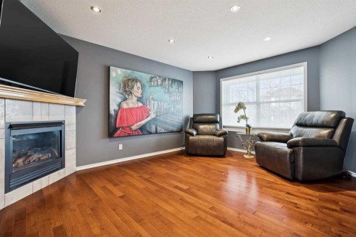 27 Everstone Way Sw, Calgary, AB - Indoor Photo Showing Living Room With Fireplace