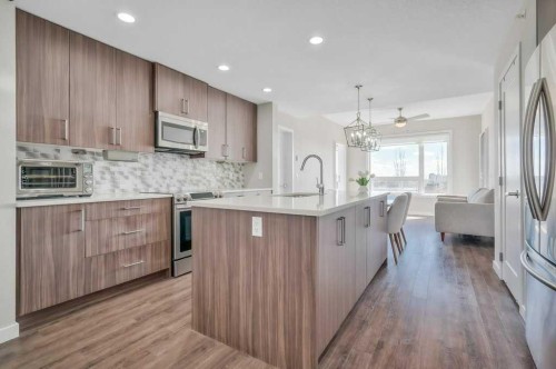 402-8531 8A Avenue Sw, Calgary, AB - Indoor Photo Showing Kitchen With Upgraded Kitchen