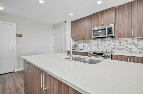 402-8531 8A Avenue Sw, Calgary, AB - Indoor Photo Showing Kitchen With Double Sink With Upgraded Kitchen